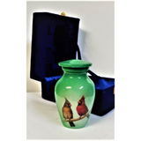 A cardinal Themed keepsake cremation urn or ash urn 