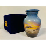 a themed nautical keepsake cremation urn with dolphins