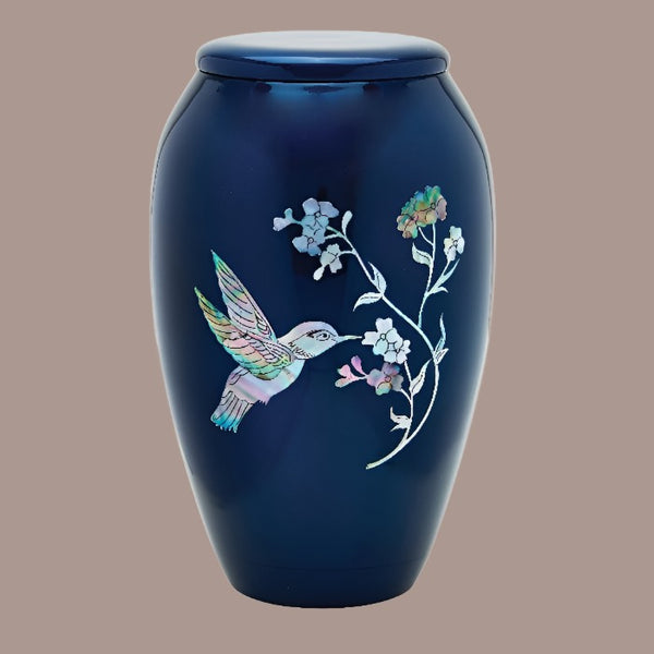 a mother of pearl hummingbird themed cremation urn 